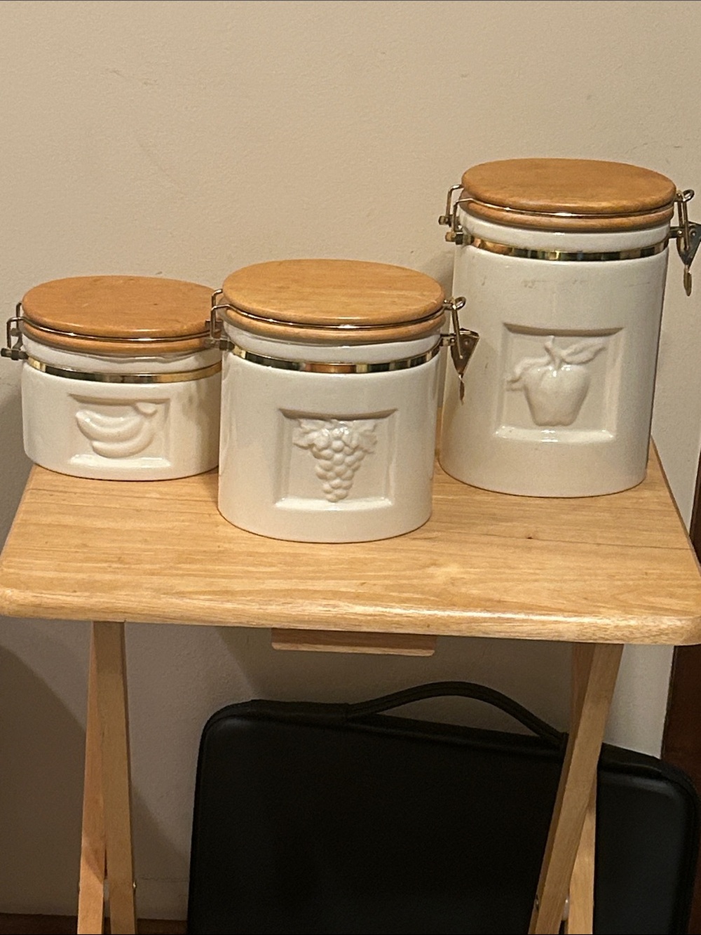 Vintage Preferred Stock Embossed Ceramic Kitchen Canister Set with wooden lids.